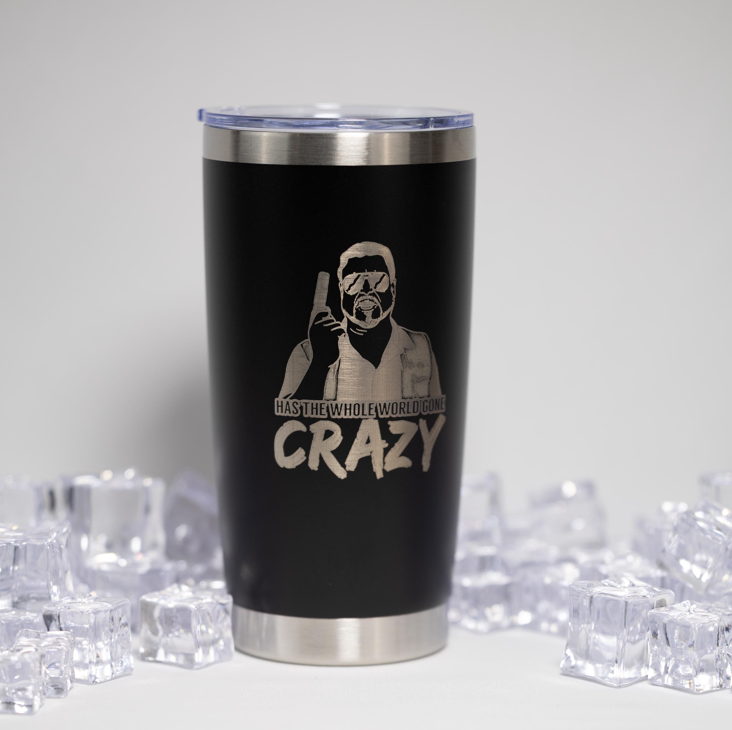 A black tumbler with a silver lid, featuring a printed design of a person wearing goggles and holding a gun, along with the text "HAS THE WHOLE WORLD CRAZY" printed on it.