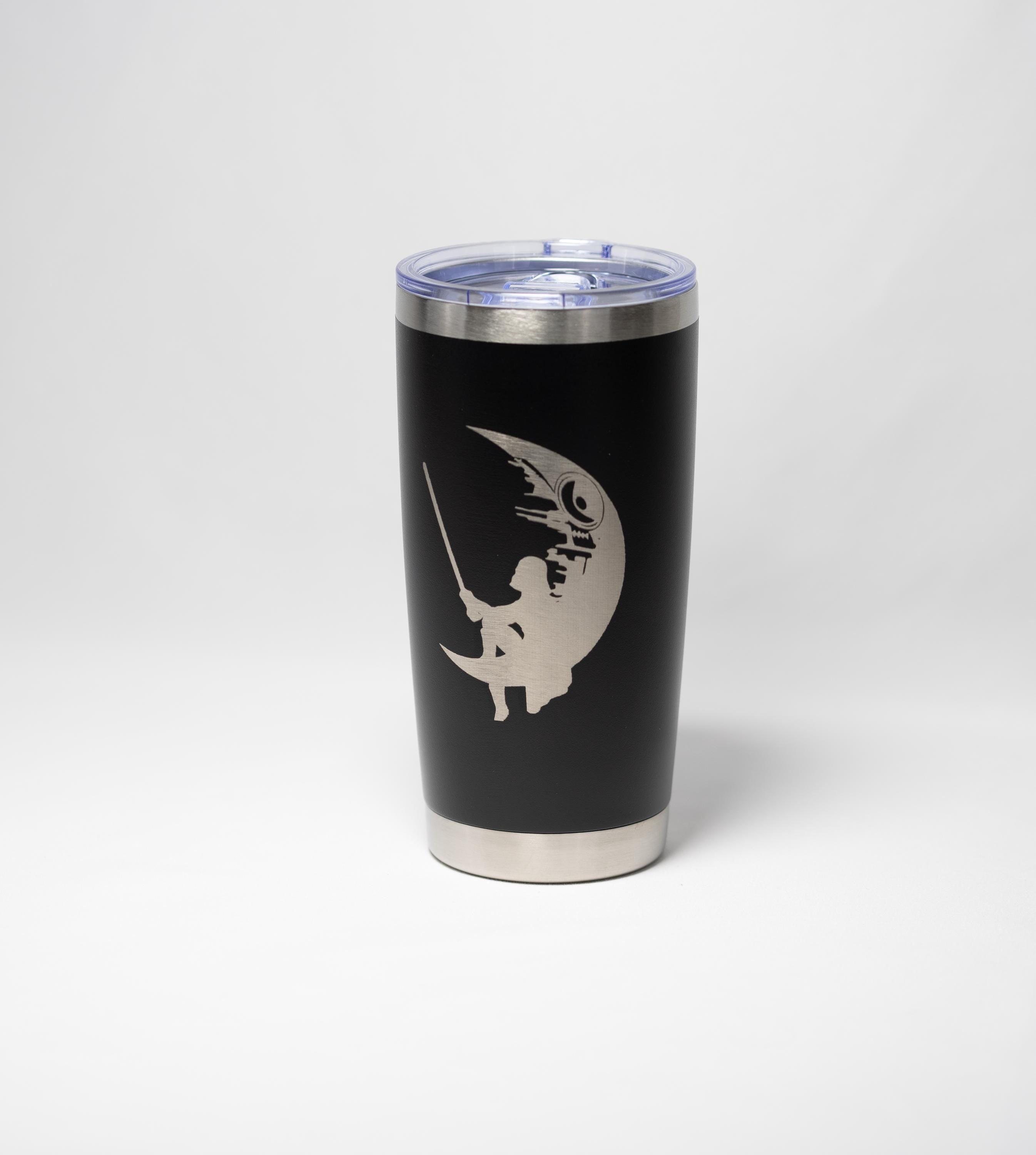 A black tumbler with a silver lid and a silver silhouette of a person holding a fishing rod on the front.